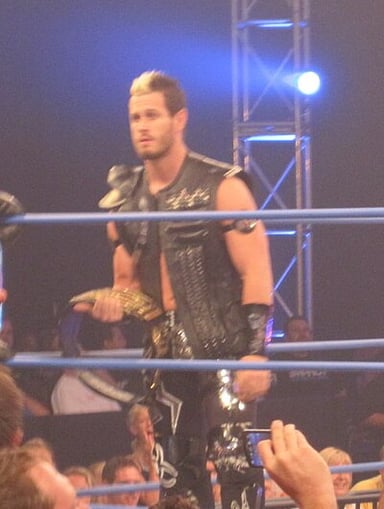 In which company is Alex Shelley currently signed?
