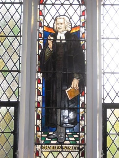 Charles Wesley briefly traveled to which colony in America?