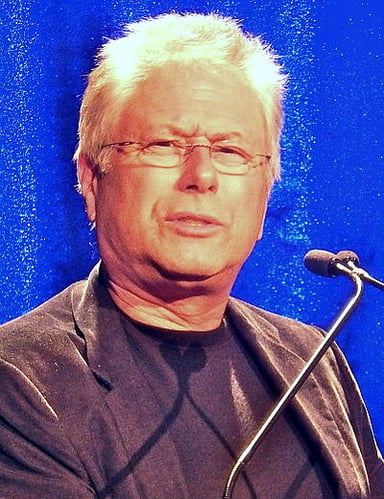 Menken's work spans both Disney and which other entertainment area?