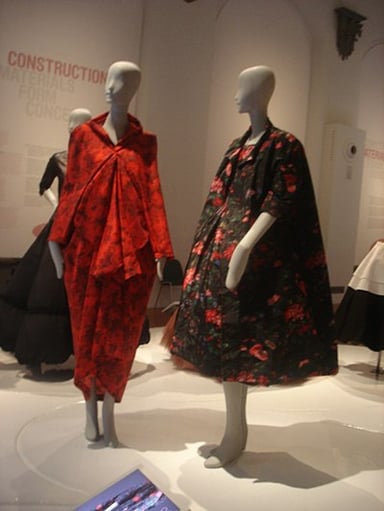 Which fashion designer is known as Balenciaga's "protege"?