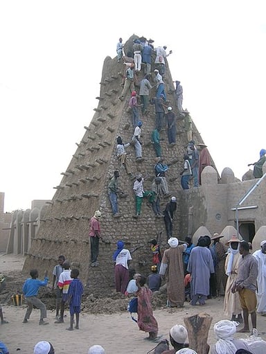 Which river flows 12 miles south of Timbuktu?