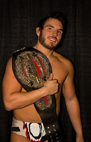 What year did Johnny Gargano sign a contract with WWE?