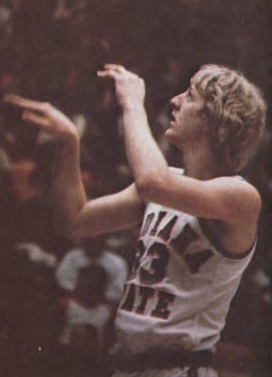Which team did Larry Bird lead to an undefeated regular season while in college?