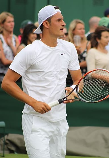 What was the first professional tournament Bernard Tomic won?