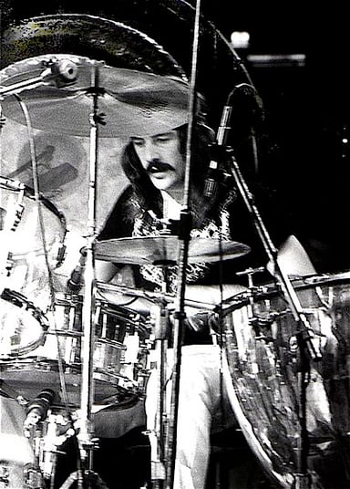 Which band did the surviving members of Led Zeppelin disband out of respect for Bonham after his death?