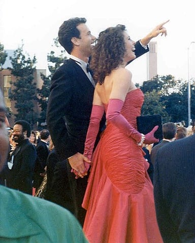 In which 1996 film did Rita Wilson co-star with Arnold Schwarzenegger?