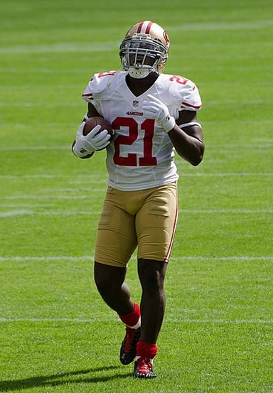 Which head coach drafted Frank Gore to the 49ers?