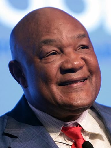 At what age did George Foreman win a gold medal in the heavyweight division at the Olympics?