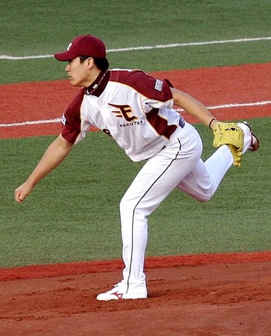Which team did Tanaka beat to set his NPB record for most consecutive wins?
