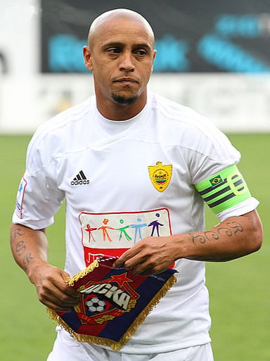 In which year did Roberto Carlos retire from professional football?