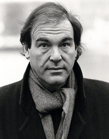 For which film did Oliver Stone win his first Academy Award for Best Adapted Screenplay?