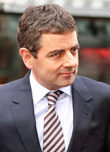 In which romantic comedy does Rowan Atkinson play a jewelry salesman named Rufus?