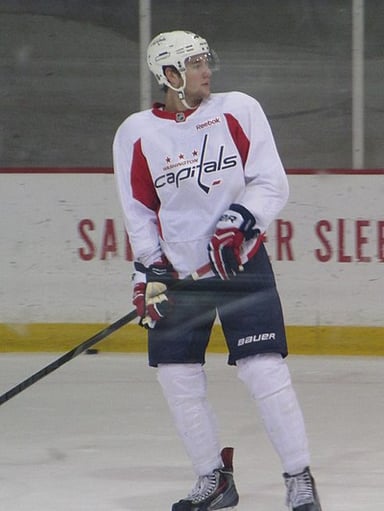 Which NHL team did Tom Wilson make his professional debut with?