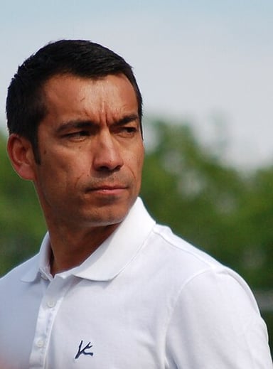 What great achievement did van Bronckhorst accomplish in his first season back at Rangers?