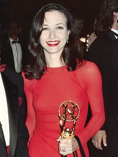 For which sitcom did Bebe Neuwirth win two Emmy Awards?