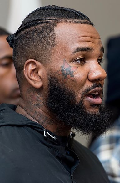 What is the real name of the rapper known as "The Game"?