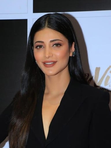 Which action thriller marked Shruti Haasan's Tamil movie debut in 2011?