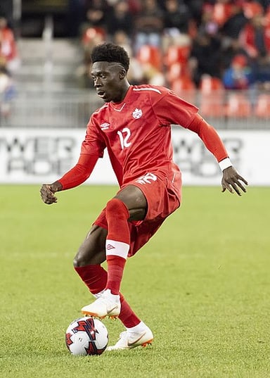 Which award did Alphonso Davies win in 2021 and 2022?