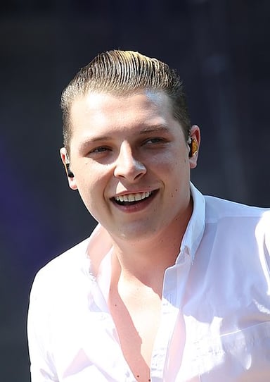 What is the full name of the singer John Newman?