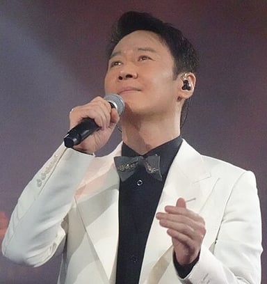What genre of music does Leon Lai sing?