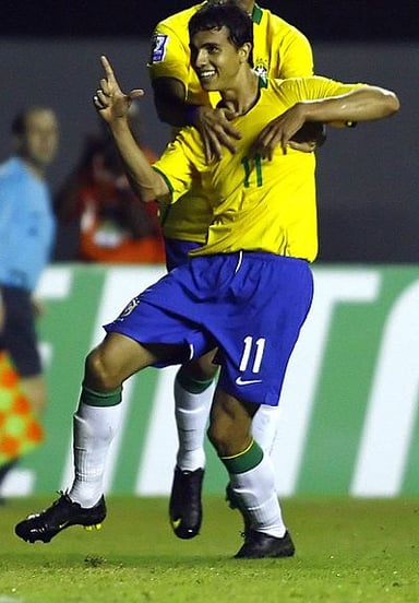 Against which team did Nilmar make his international debut for Brazil?