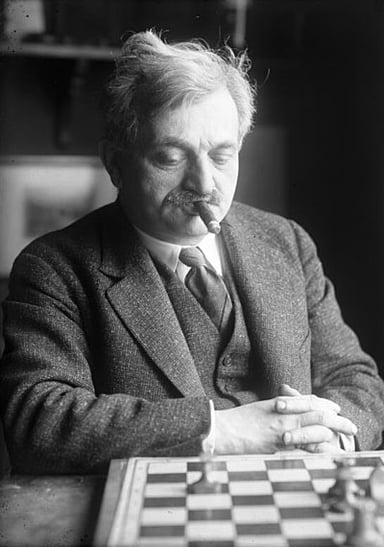 Which chess player did Emanuel Lasker defeat to become World Chess Champion?