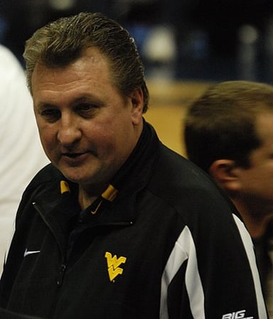 When did Huggins retire from West Virginia?