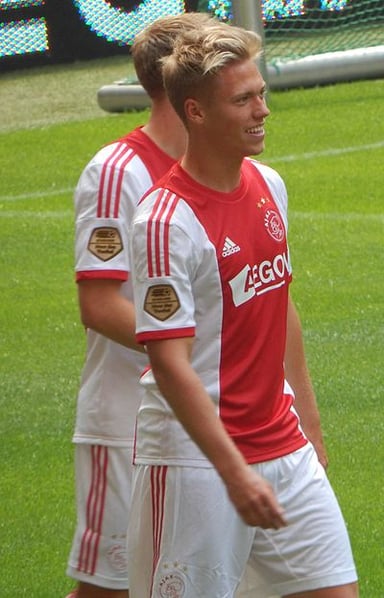 Against which country did Fischer make his debut for Denmark?