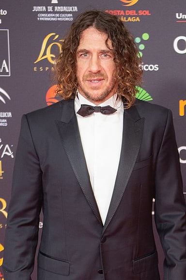 In which year did Carles Puyol retire from professional football?