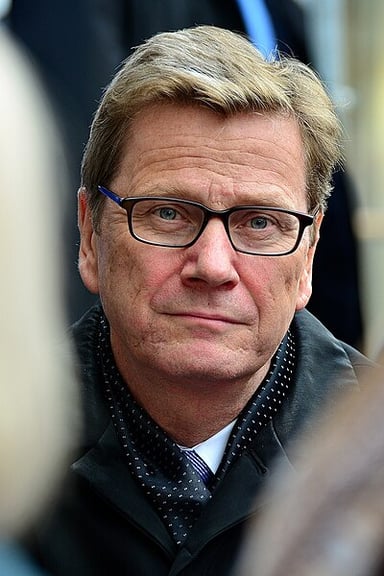 When did Guido Westerwelle step down from his party leadership position?