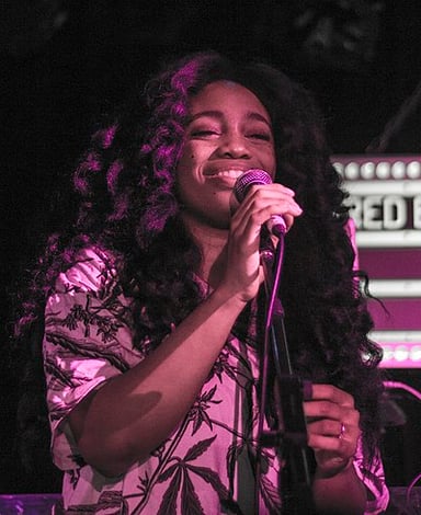 Alongside her musical success, SZA is also a recipient of which award?