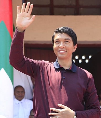 What business did Rajoelina start in 1999?