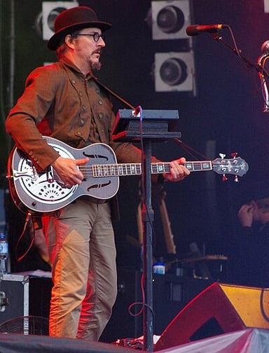 What instrument is Les Claypool famous for playing?