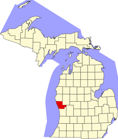 What large body of water is Muskegon situated around?