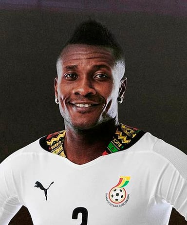 Which club did Asamoah Gyan begin his professional career with?