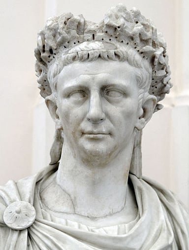 What part of the empire did Claudius begin to conquer?