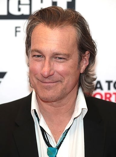 In which sci-fi film did John Corbett play a character named Stark?