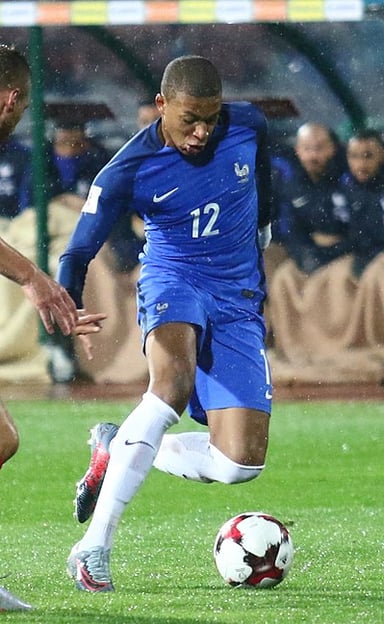 Which number did Kylian Mbappé have while playing for [url class="tippy_vc" href="#143355"]France National Association Football Team[/url]?