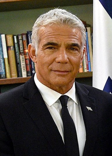 What language does Lapid speak as his mother tongue?