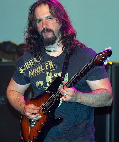 Petrucci's guitar playing is often described as?