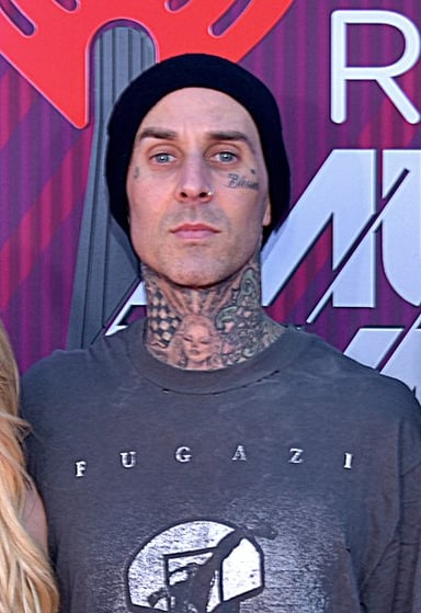 What instrument is Travis Barker best known for playing?