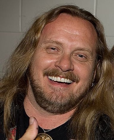 What instrument is Johnny Van Zant best known for playing?
