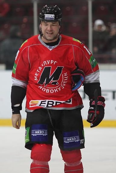 Chris Simon played in the KHL for which team?