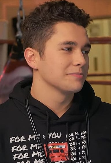 Name one of Austin Mahone's hit singles featuring Pitbull.