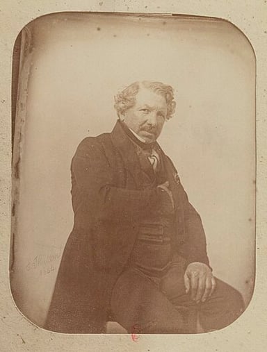 Besides photography, what was one of Daguerre's other professions?