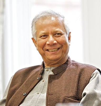 What academic degree has Muhammad Yunus achieved?