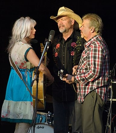 As a musician, does Emmylou Harris play any instruments?