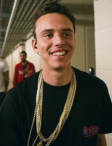 Which record label did Logic sign with for his first commercial releases?