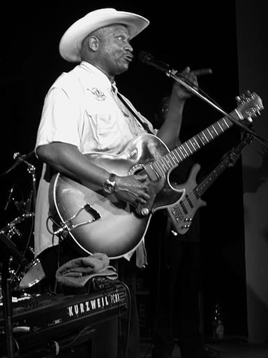 Taj Mahal often includes sounds from which island in his music?