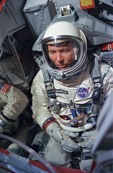 Which title did Schirra hold in the U.S. Navy when he first became an astronaut?